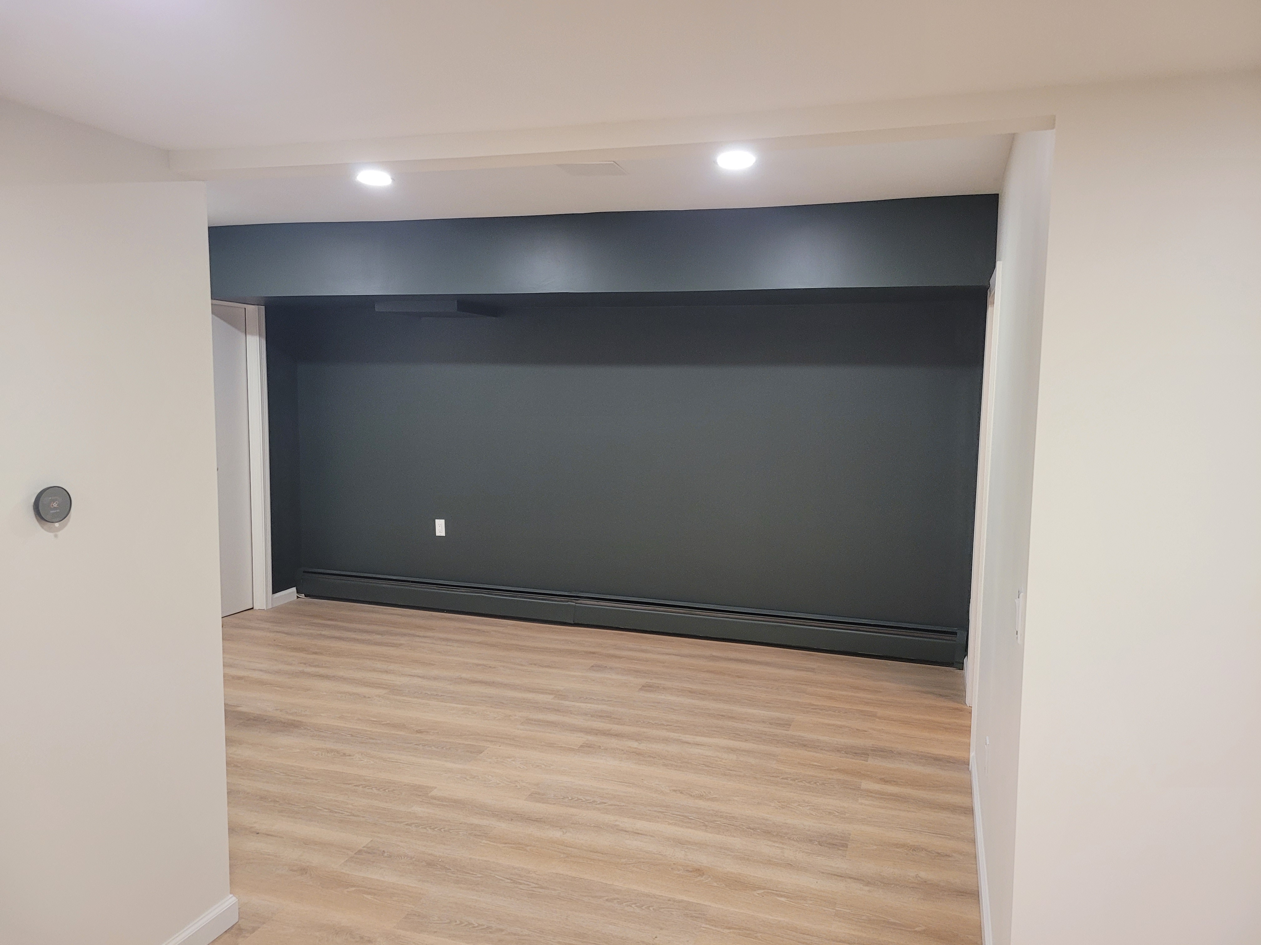 Finished basement dark accent wall alcove near the stairway by Rome Leite Home Improvement in Danbury, CT