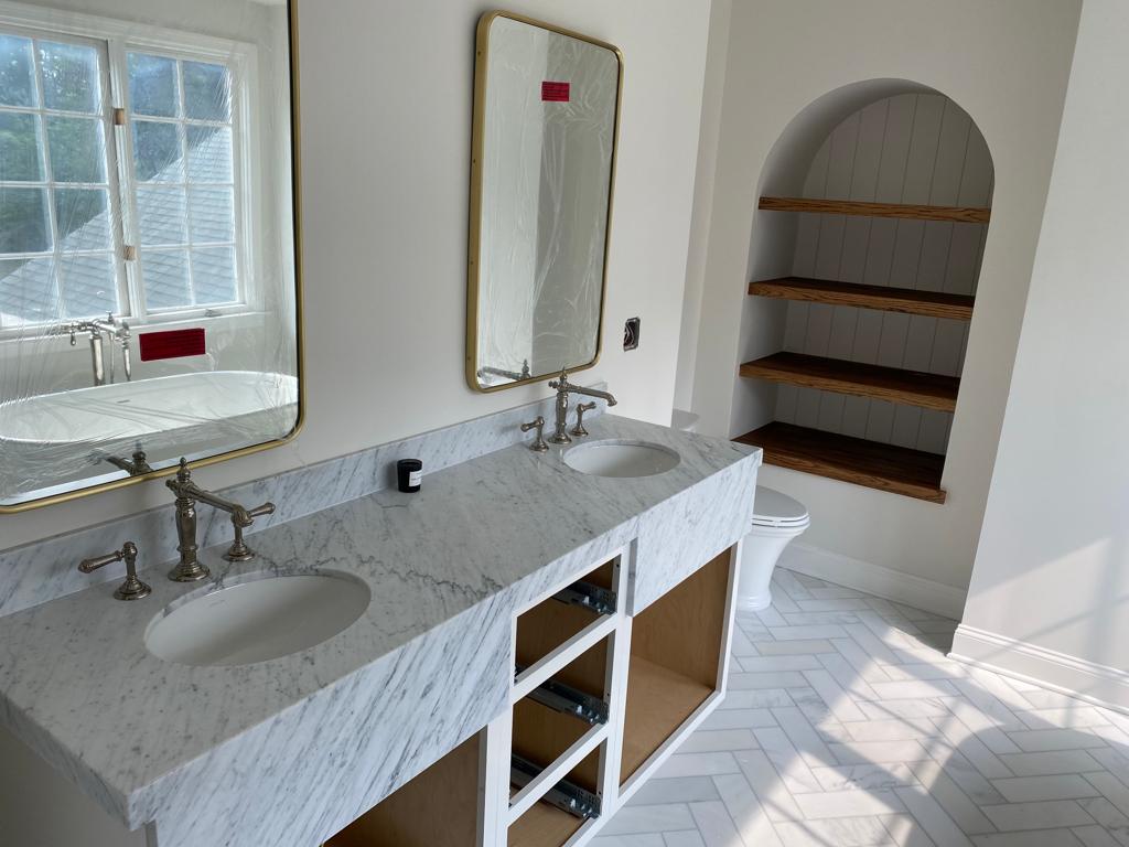 Double vanity marble bathroom remodel by Rome Leite Home Improvement