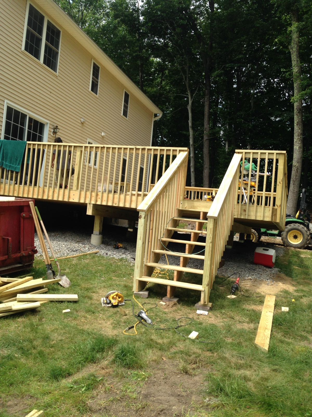 Nearly finished wood deck with a half-built gate in the railing by Rome Leite Home Improvement in Danbury, CT