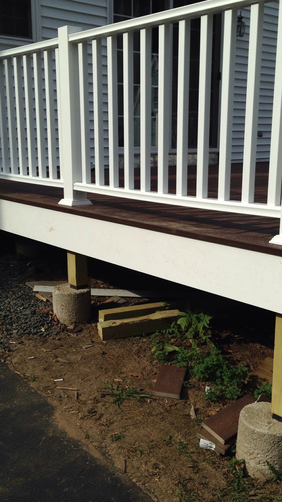View from a deck with white vinyl railing looking out over a driveway by Rome Leite Home Improvement in Danbury, CT