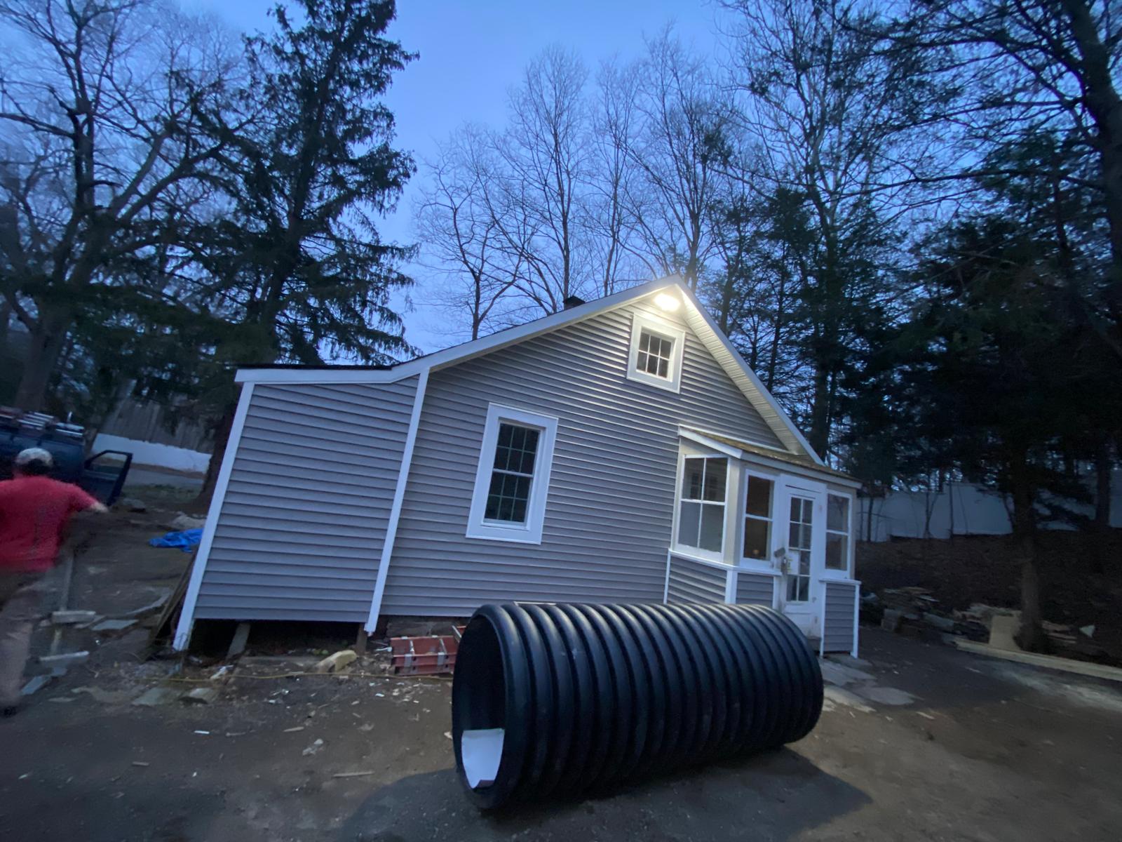 Finished exterior siding renovation, wide view by Rome Leite Home Improvement