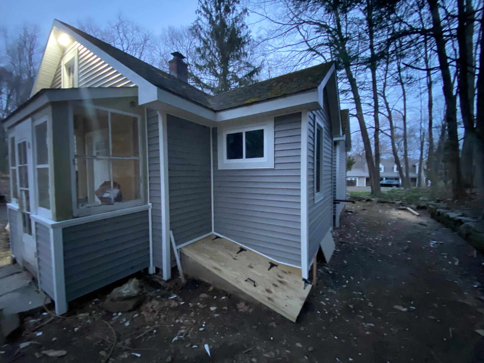 Finished exterior siding and window trim by Rome Leite Home Improvement