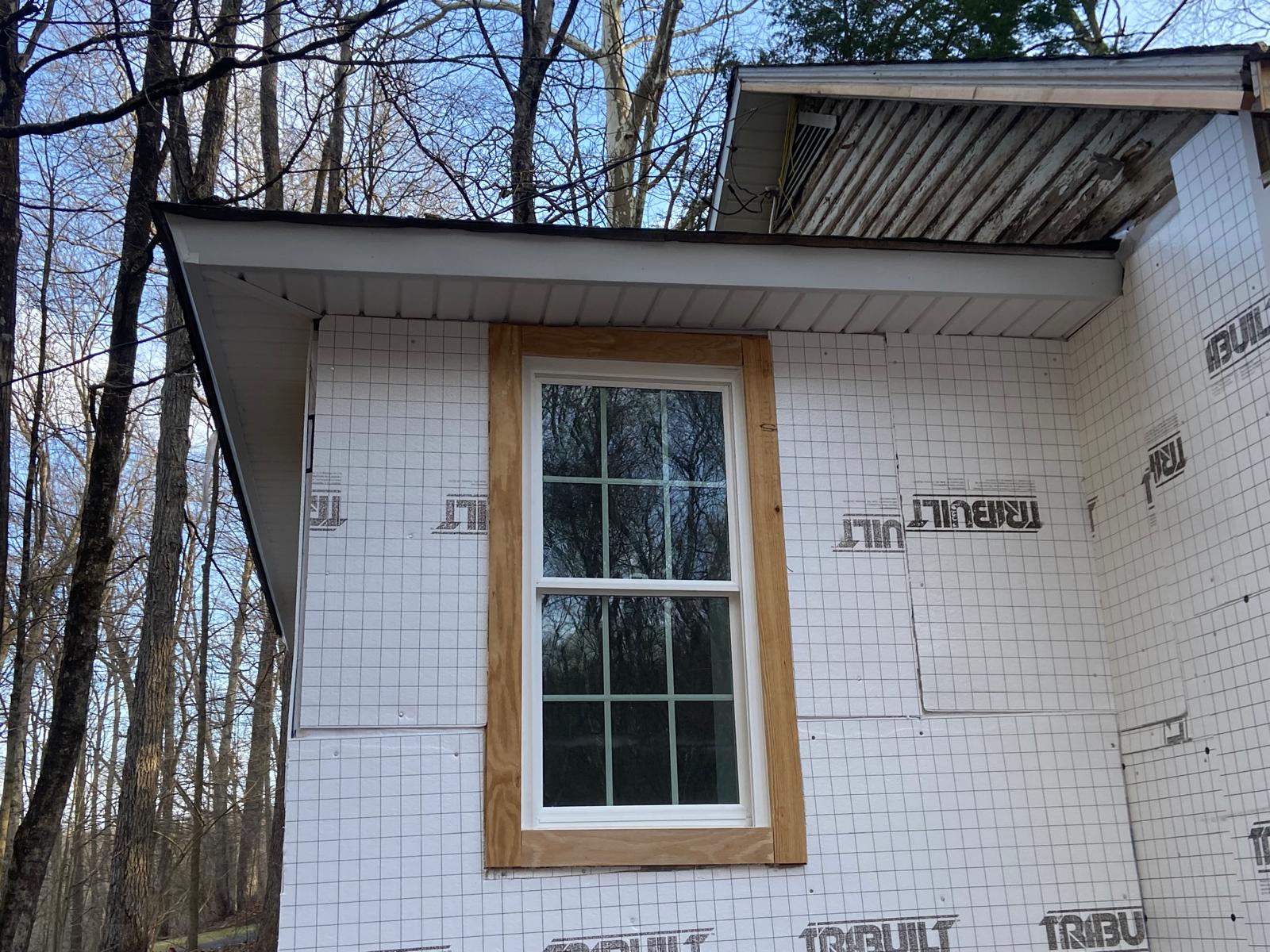 Close-up of a newly installed double-hung window with wood trim casing by Rome Leite Home Improvement in Danbury, CT