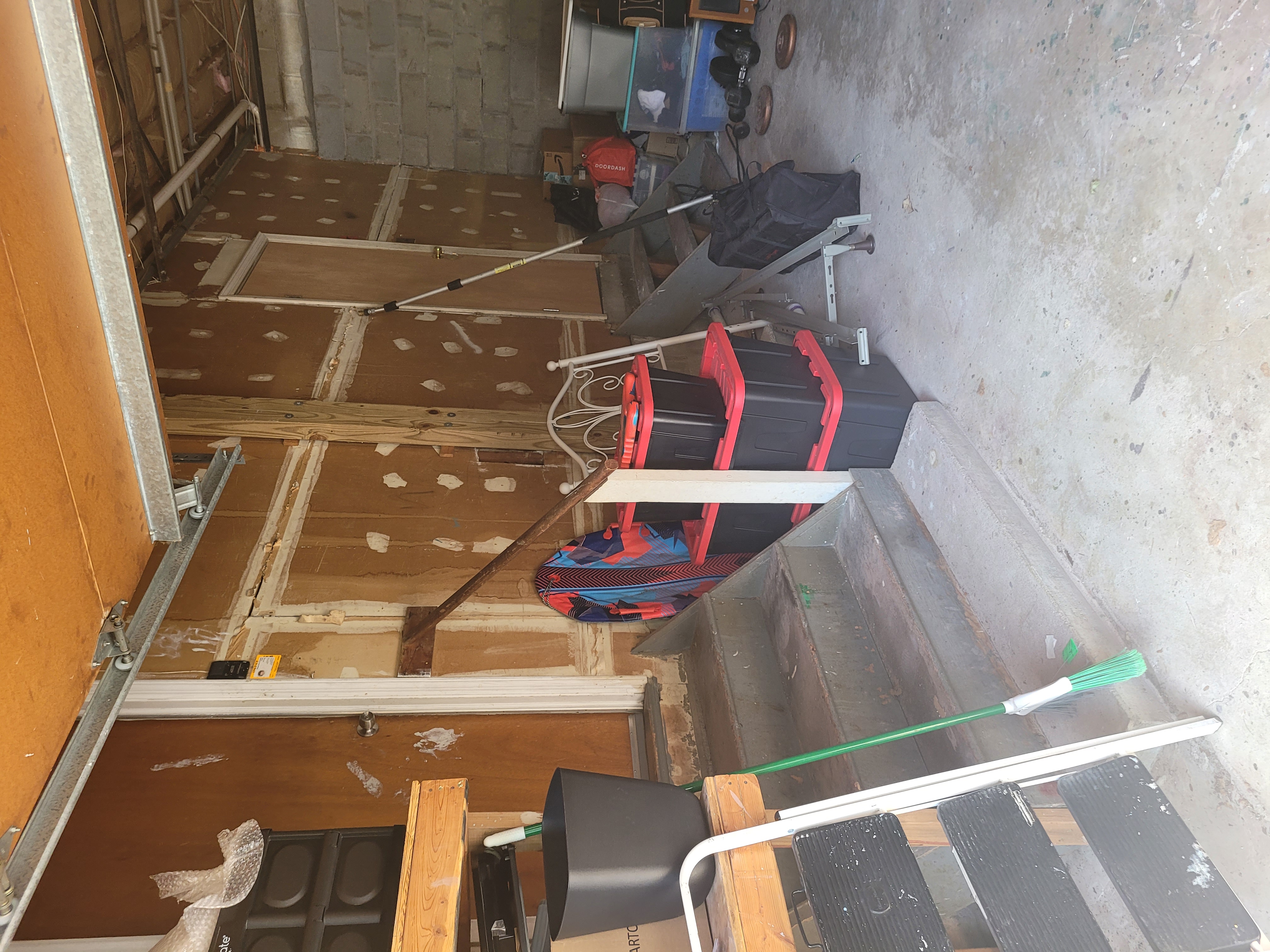 Garage storage area with storage totes and furniture by Rome Leite Home Improvement in Danbury, CT