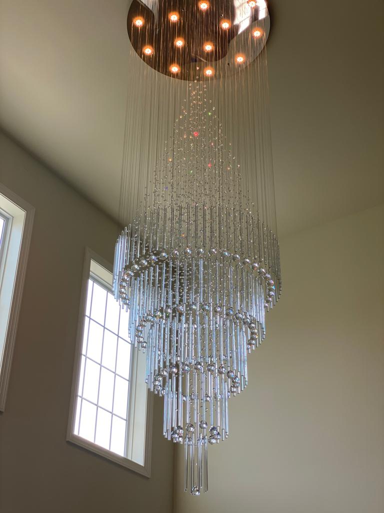 Statement chandelier installation by Rome Leite Home Improvement